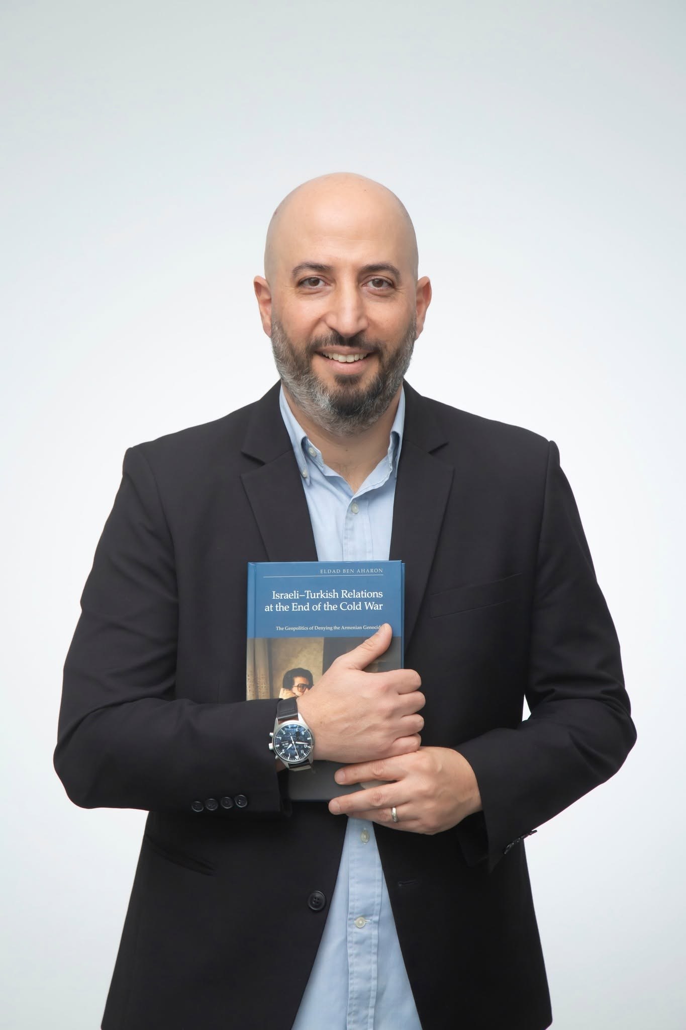 Eldad Ben Aharon holding his book